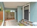 Inviting front porch with colorful tiled steps and a modern black front door at 523 W Hancock St, Lakeland, FL 33803
