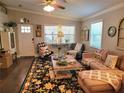 Cozy living room featuring stylish furnishings, large area rug, and natural lighting at 807 Osceola St, Lakeland, FL 33801