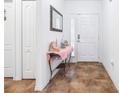 Bright entryway features tile flooring, a decorative table, and access to other areas of the home at 983 Revere Ave, Haines City, FL 33844