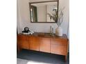 Elegant entryway showcasing a stylish console table, decorative mirror, and contemporary décor at 1217 King Ave, Lakeland, FL 33803