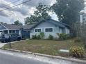Charming home with lush front yard, showcasing its curb appeal in a serene neighborhood at 1217 King Ave, Lakeland, FL 33803