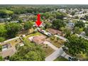 Property aerial view, highlighting the home's position within a neighborhood surrounded by mature trees at 137 Leitha Way, Lakeland, FL 33809