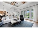 Bright living room with floor-to-ceiling windows and an open-concept design at 2551 Delphi Woods Cir, Lakeland, FL 33812