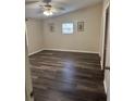 Bright bedroom with vaulted ceilings, ceiling fan, wood-look flooring, and natural light at 2621 Island Oaks W, Lakeland, FL 33805