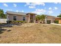 Attractive single-Gathering home featuring desert landscaping and a convenient two-car attached garage at 2812 Hickory Ridge Dr, Lakeland, FL 33813