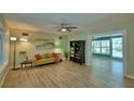 Cozy living room featuring hardwood floors, stylish furnishings, and ample natural light at 346 Tanager Ct, Lakeland, FL 33803
