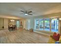 Bright, open-concept living room featuring hardwood floors and large windows at 346 Tanager Ct, Lakeland, FL 33803