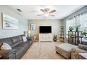 Comfortable living room featuring plush seating, carpet floors, and neutral paint, creating a relaxing atmosphere at 3560 Spring Creek Rd, Dundee, FL 33838