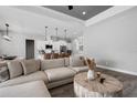 Open-concept living room and kitchen area with modern lighting fixtures at 3664 Frentress Dr, Lakeland, FL 33812