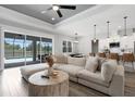Open-concept living room with large sofa and access to the outdoor pool area at 3664 Frentress Dr, Lakeland, FL 33812