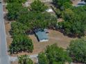 Aerial view of single-story home with a new roof and surrounding trees at 3705 Garland St, Mulberry, FL 33860