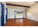 Spacious living room with hardwood floors, vaulted ceilings, and exposed beams at 400 6Th Ne St, Fort Meade, FL 33841