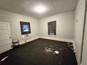 A basic bedroom with natural light, showing the need for thorough cleaning and possible renovation at 4885 Cherry Dr, Mulberry, FL 33860