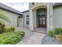 Inviting front entrance featuring a double-door entry and a stone walkway leading to the house at 6347 Ashley Dr, Lakeland, FL 33813