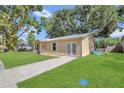 A quaint home showcasing a green lawn, and a welcoming driveway, perfect for families at 7208 Thomas Jefferson Cir, Bartow, FL 33830