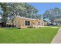 Inviting single-level residence with lush front lawn, blending comfort and style at 7208 Thomas Jefferson Cir, Bartow, FL 33830