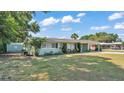 Charming home with a well-kept lawn and mature trees at 118 Lake Sears Dr, Winter Haven, FL 33880