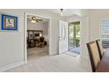 Bright entryway with an open view to the office space and dining room at 1519 Blue Sky Blvd, Haines City, FL 33844