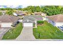Aerial shot of the property showing the home's layout, landscaping, and neighborhood at 242 Kings Pond Sw Ave, Winter Haven, FL 33880