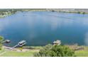 Expansive lake view featuring boat docks in this aerial photograph at 254 Lake Tennessee Dr, Auburndale, FL 33823