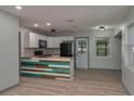 Updated kitchen with a colorful island, sleek appliances, and modern finishes at 315 Eastway Dr, Lakeland, FL 33803