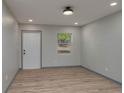 Bright living room with wood-look floors, fresh paint, and natural light at 315 Eastway Dr, Lakeland, FL 33803