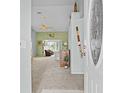 Welcoming foyer featuring neutral carpet, fresh paint, and a view into the living area at 3341 Highland Fairways Blvd, Lakeland, FL 33810