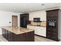 Modern kitchen with granite countertops, stainless steel appliances, and custom cabinets at 4008 S Carlisle Rd, Lakeland, FL 33813