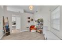 Cozy sitting area with a reading nook, tile floors, and natural lighting at 412 Emerald Cove Loop, Lakeland, FL 33813