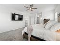 Comfortable main bedroom with a large TV and neutral tones at 4122 Conjunction Way, Apopka, FL 32712