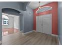 Welcoming foyer with new floors and a view into another room at 6086 Swallow Dr, Lakeland, FL 33809
