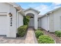 Inviting walkway to a charming front door with beautiful landscaping at 6086 Swallow Dr, Lakeland, FL 33809