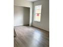 Bedroom with light gray walls, modern flooring and a new window at 629 W 9Th, Lakeland, FL 33805