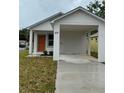 Charming single-Gathering home with a covered carport and a brightly colored front door at 629 W 9Th, Lakeland, FL 33805