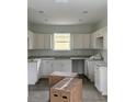 Bright, spacious kitchen with recessed lighting, modern cabinets and countertops, and new flooring at 629 W 9Th, Lakeland, FL 33805
