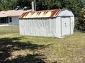 Metal storage shed located in the backyard, providing extra storage space for tools and equipment at 6610 Chippendale Rd, Lakeland, FL 33809