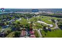 Aerial view of villas with easy access to Lakeland Square, Interstate 4, and a green golf course at 733 Carpenters Way # 36, Lakeland, FL 33809