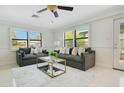 Cozy living room with two sofas, plantation shutters, and ample natural light create a warm, welcoming atmosphere at 865 E Mann Rd, Bartow, FL 33830