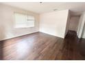 Bright living room showcasing hardwood floors, neutral walls, and ample natural light at 1160 Austin St, Bartow, FL 33830
