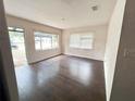 Inviting living room with lots of natural light and beautiful wood floors at 1160 Austin St, Bartow, FL 33830