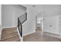 Bright interior shot showcasing the staircase with modern black railing and neutral tones at 1171 Windjammer Dr, Lakeland, FL 33803