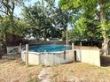 Backyard area features an above ground pool, perfect for summer fun and relaxation at 135 E Columbia St, Lake Alfred, FL 33850