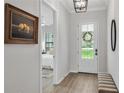 Inviting hallway view with a glimpse into the bedroom, showcasing a peaceful interior at 1415 S Lincoln Ave, Lakeland, FL 33803
