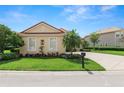 Charming one-story house with a well-kept lawn and a neat garden landscape at 1772 Laurel Glen Pl, Lakeland, FL 33803