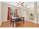 Inviting dining room featuring a wooden table, chairs, and large window at 1837 Farrington Dr, Lakeland, FL 33809