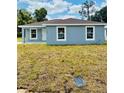 Inviting single-story home with a well-maintained lawn and a freshly painted exterior at 2220 W Lanier St, Lakeland, FL 33815