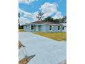 Charming single-story home with a long driveway and newly landscaped front yard at 2220 W Lanier St, Lakeland, FL 33815