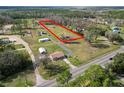 Spacious property showcasing a cozy home nestled within a large, verdant landscape at 2323 State Road 33, Clermont, FL 34714