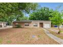 A single-story home with a traditional design set on a spacious lot at 236 Hillside Dr, Lakeland, FL 33803