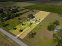 Aerial view showcasing the layout of the home and the surrounding land within property lines at 2500 Brooke Rd, Fort Meade, FL 33841